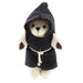 Small cream coloured bear wearing a black monk robe. 