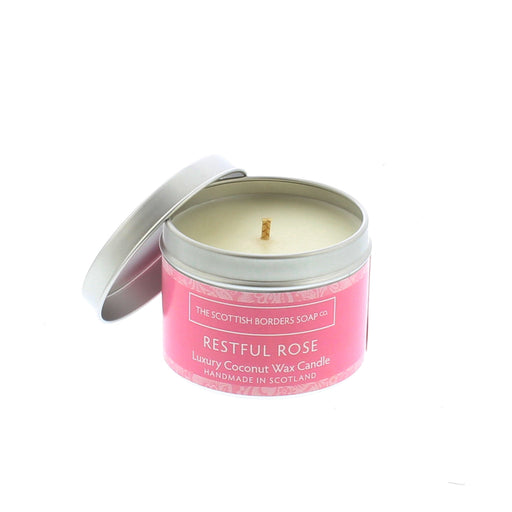 Silver Candle Tin with a pink label containing a rose scented candle. 