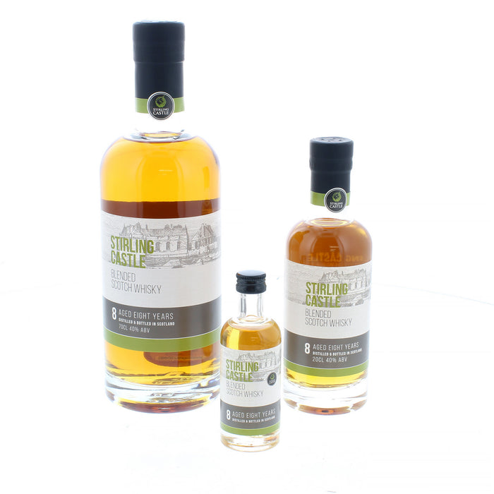 The official Stirling Castle Whisky shown in 3 glass bottles of different sizes. These include a 70, 20 and 5cl. The label has Stirling Castle written on it in a green font with an  image of the castle in the background. 