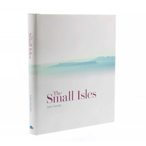 The Hardback copy of the publication 'The Small Isles' features the title written in a dark red over a white cover with a watercolour style image of far away islands. 
