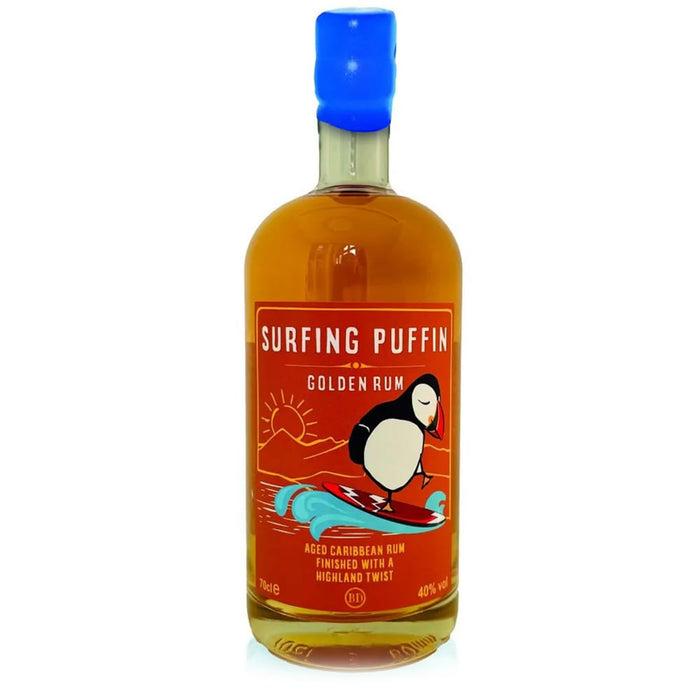 Bottle of Surfing Puffin Golden Rum with a colorful label on a white background - Image