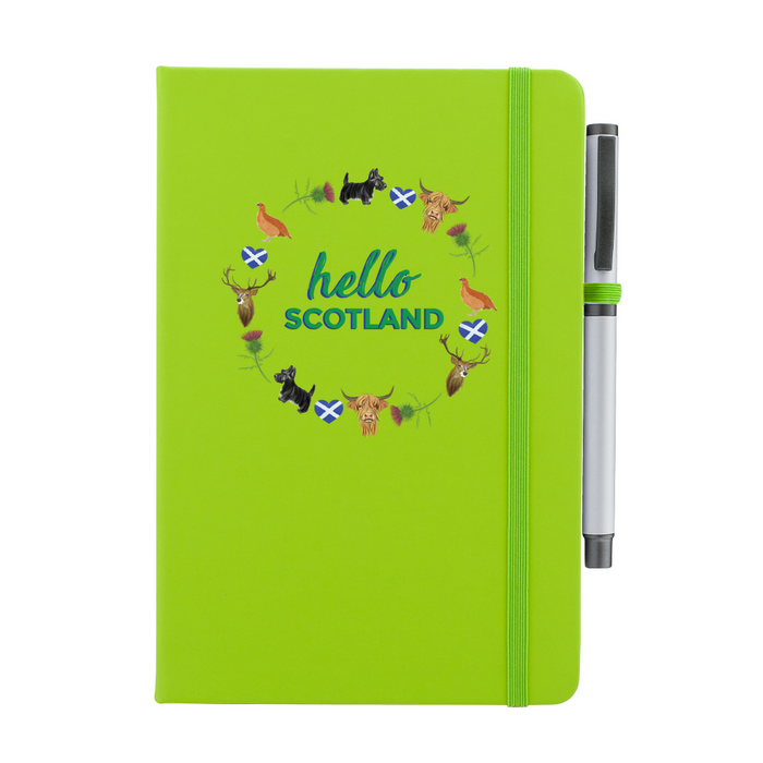 Lime Green notepad with pen features a circular prints of Scottish Icons including the St Andrews Flag in a loveheart shape, a pheasant and a deer. A matching strap closes on the right hand side.