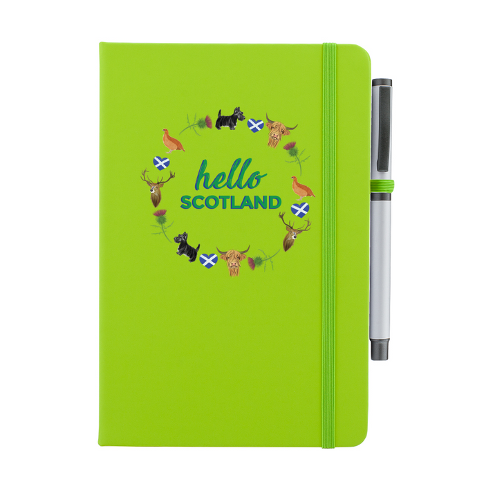 Green notebook featuring a circular design of Scottish animals and emblems. 