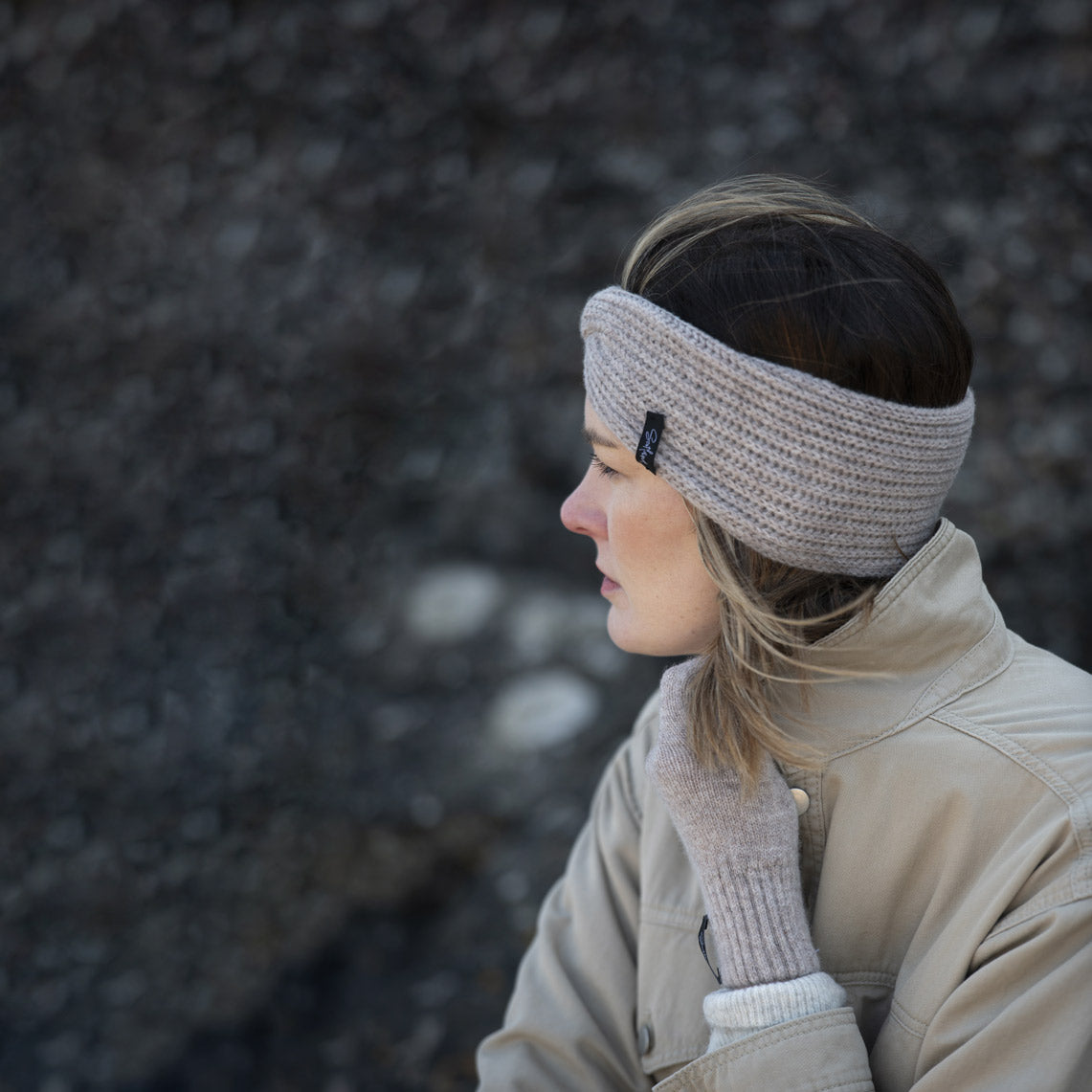 women with teviot knitwear stone coloured knitted headband and gloves and dark stone background