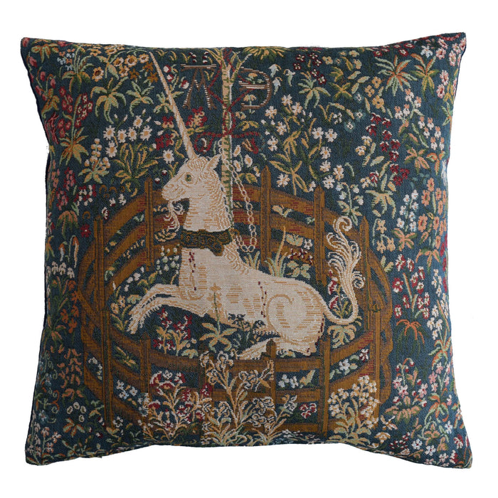 Blue velvet cushion featuring the Captive Unicorn surrounded by flowers and shrubs 
