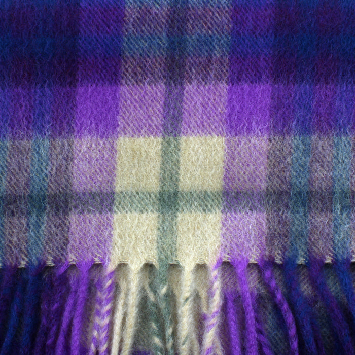 close up of the tartan cashmere scarf in purple and beige 