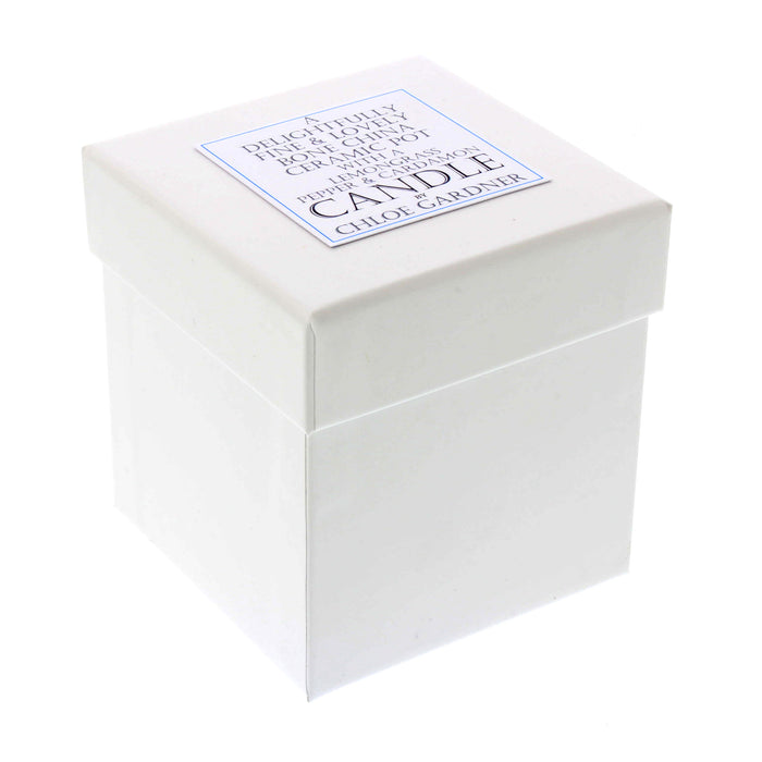 white packaging box with words a delightfully fine & lovely bone china ceramic pot with a lemongrass pepper & cardamon candle