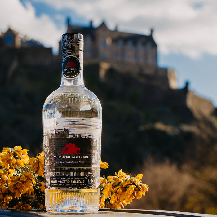 edinburgh castle gin shown in front of the castle in sunshine