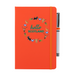 A beautiful designed orange notebook with the words 'Hello Scotland' in green,  featuring elements of Scottish culture and scenery. An orange strap closes over the right hand side with a matching pen.