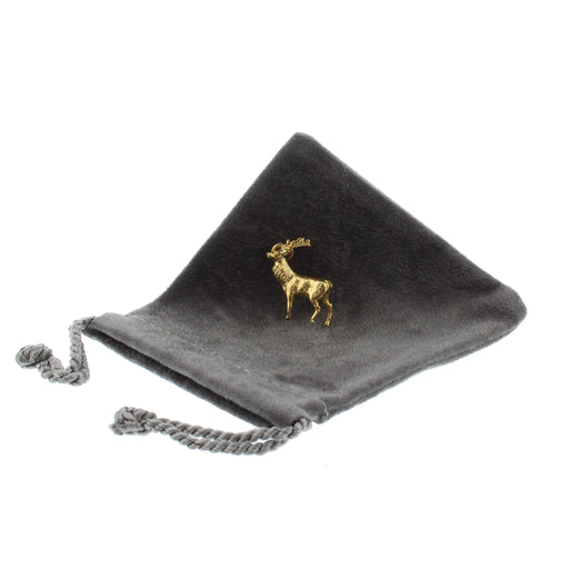 stag charm 22ct Gold Plated on Brass shown on grey fabric pouch