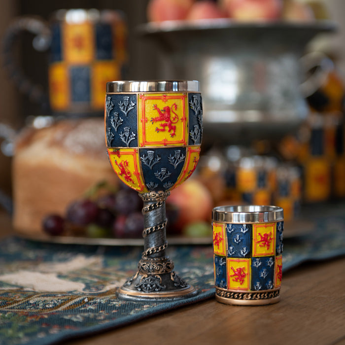 heraldic goblet shown on table next to tot cup