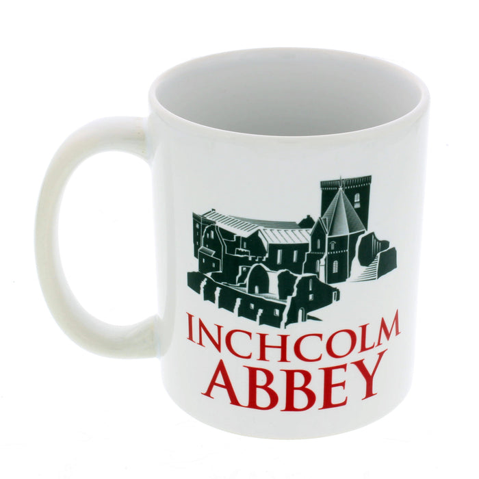 white inchcolm abbey coffee mug with red text and illustration of the abbey above the text