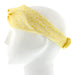 White mannequin head shows a lace print headband in yellow and white 