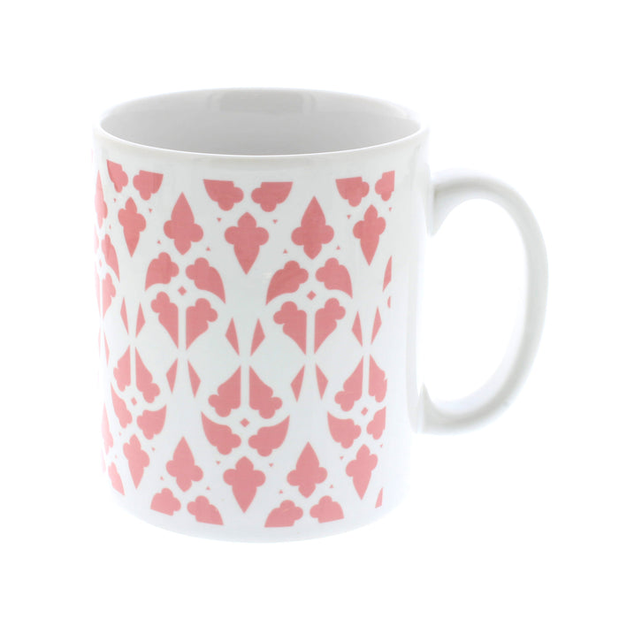 White ceramic mug with a all over pink print inspired by castle windows 