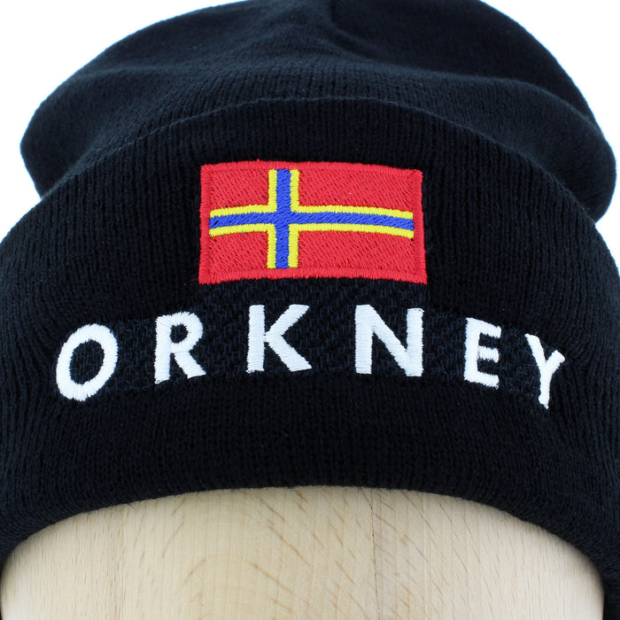 beanie hat close up detail showing the word orkney embroidered on with orkney flag also on cap