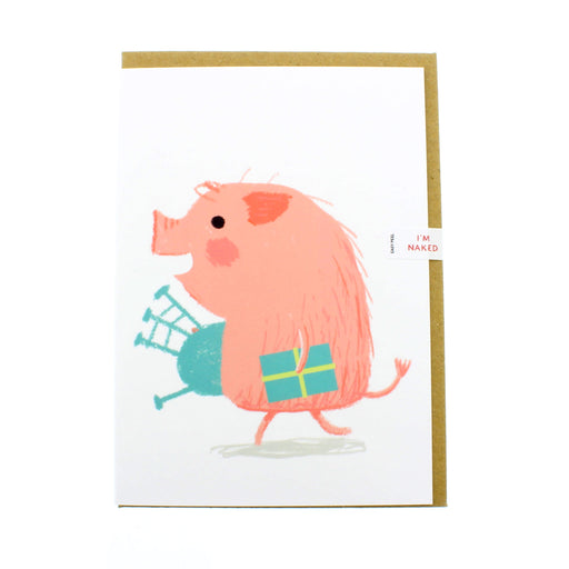 White greeting card features a pink pig carrying a present wrapped in blue and blue bagpipes 