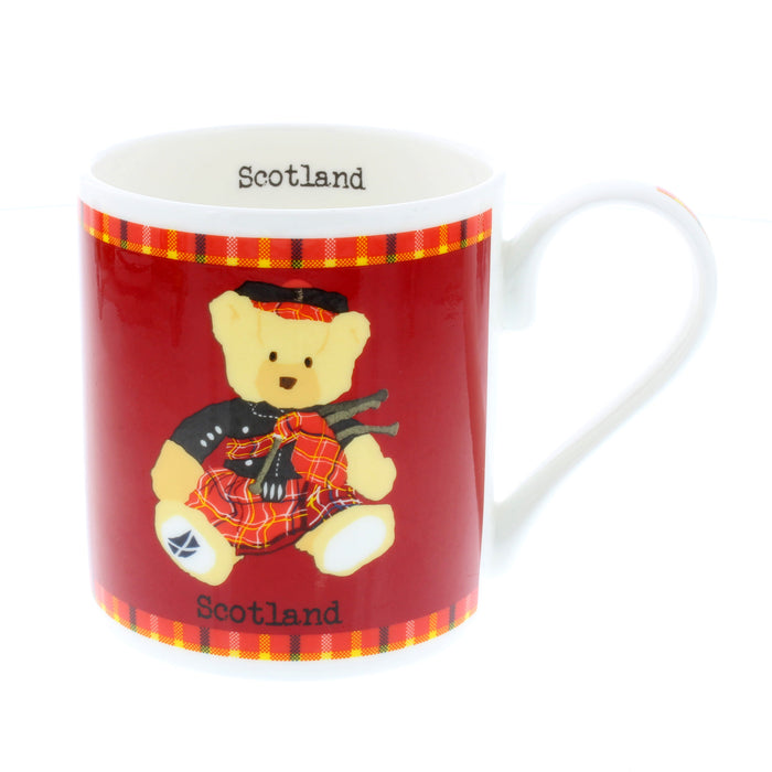 scotland piper bear red coffee mug with white handle and word scotland inside rim of mug