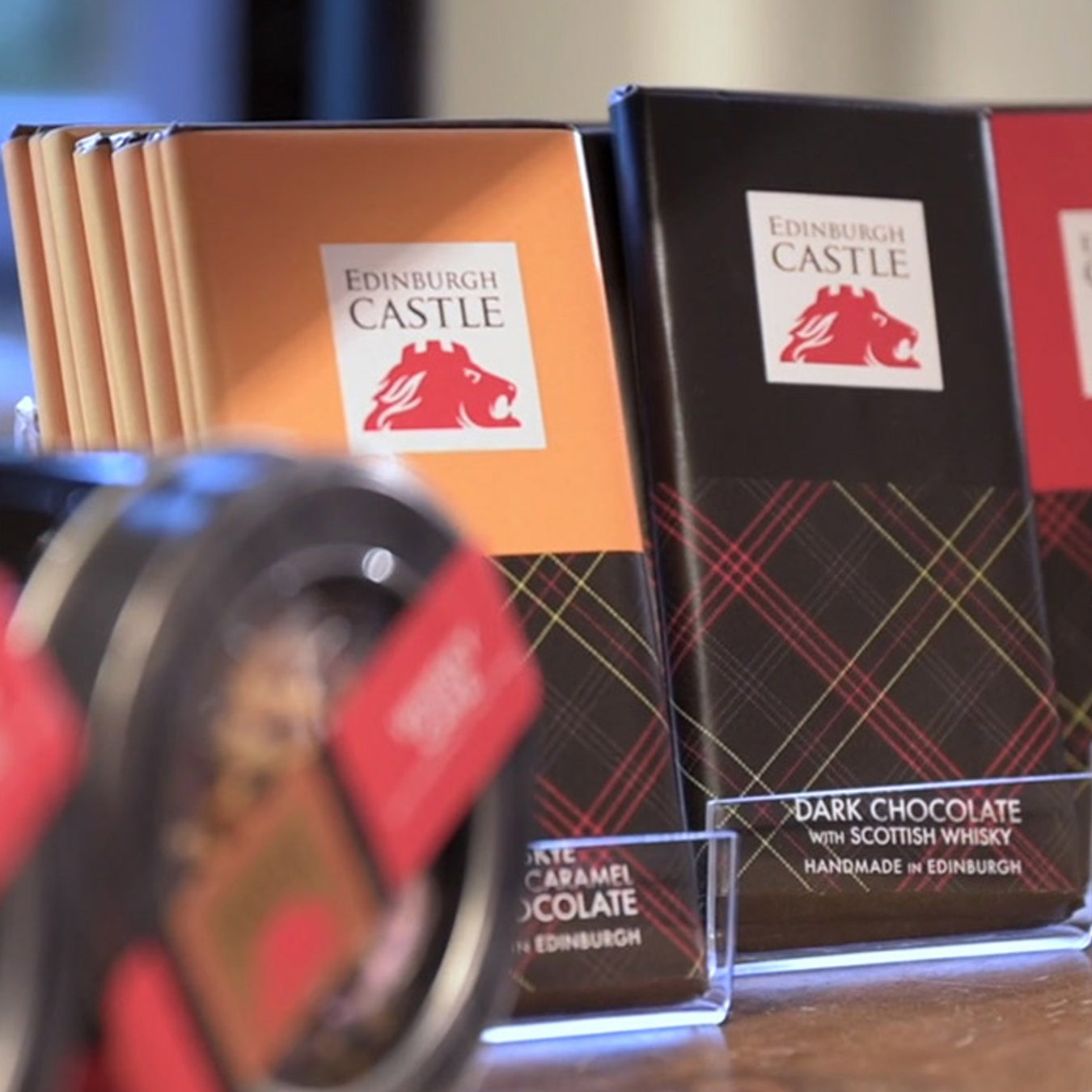 quirky chocolate edinburgh castle chocolate bars shown on shelves in shop