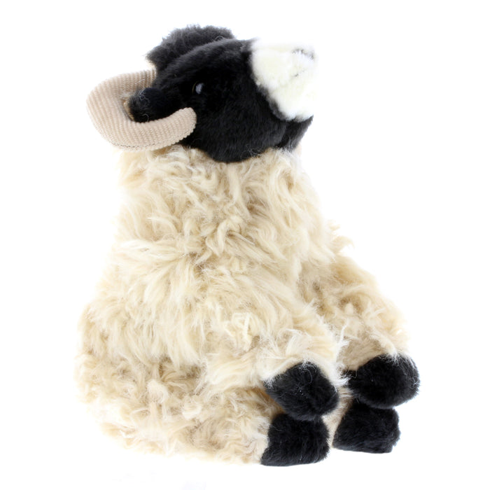 Cuddly soft Highland sheep toy in seated position
