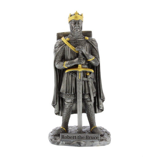 A pewter coloured figurine depicting Robert the Bruce holding a sword, with his Lion Rampant shield on his back. The figurien is finished with gold hand painted accents.