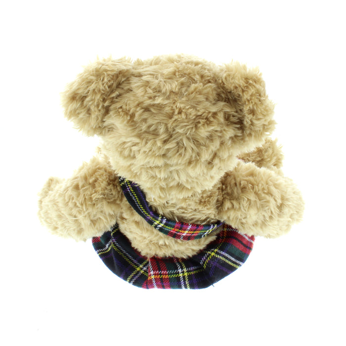 kilted teddy bear looking from above