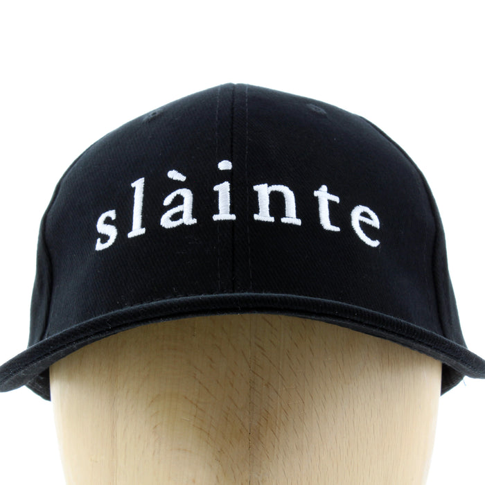 close up of slainte baseball cap black cotton with white lettering