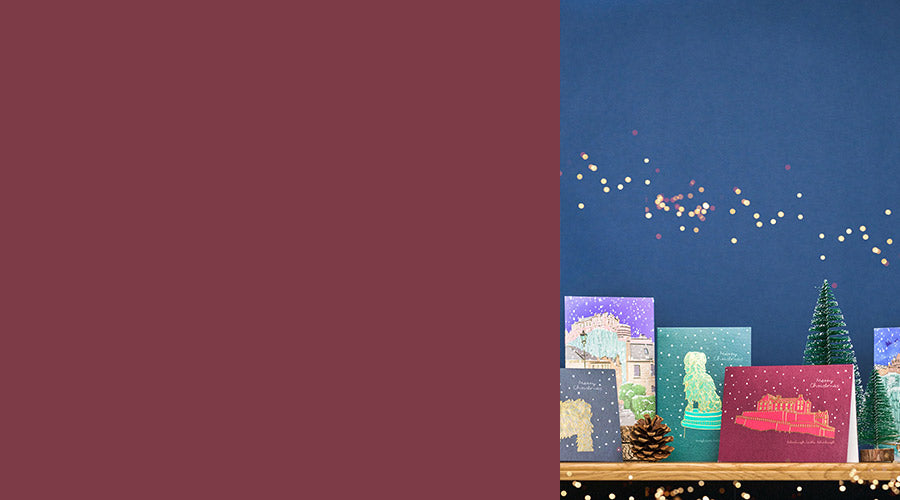 Decorative Christmas scene with colorful cards and a tree on a dark blue background. - Image