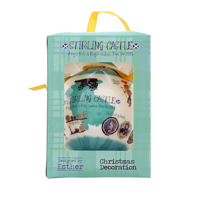 A Stirling Castle themed Christmas decoration in its original mint green and light blue packaging box with a yellow handle, on a white background. - Image