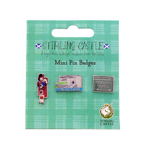 Packaged Stirling Castle mini pin badges on a green plaid background - Image