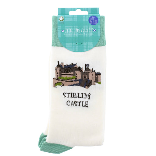 A pair of white crew socks in retail packaging, featuring an embroidered illustration of Stirling Castle and the text 'STIRLING CASTLE' on the front, with a teal plaid header card. - Image