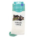 A pair of white crew socks in retail packaging, featuring an embroidered illustration of Stirling Castle and the text 'STIRLING CASTLE' on the front, with a teal plaid header card. - Image