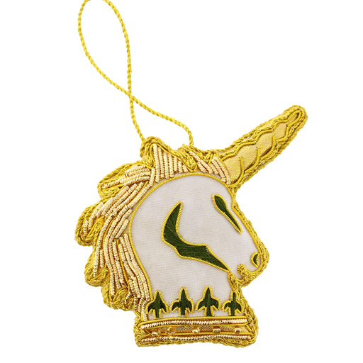 An embroidered unicorn head hanging decoration with a gold metallic border, a white face, green details, and a gold hanging loop. - Image