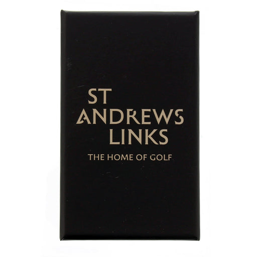 Black box with Gold text reading St Andrews Links - The home of golf - Image
