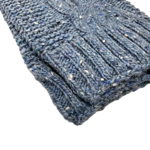 Blue knitted arm warmer on a white background. - Image