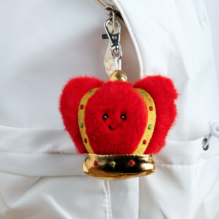 Red plush keychain toy with a gold crown on a white background - Image