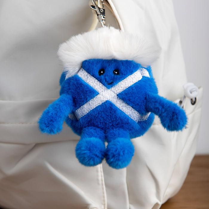 Blue Saltire plush toy keychain with white accents on a white bag - Image
