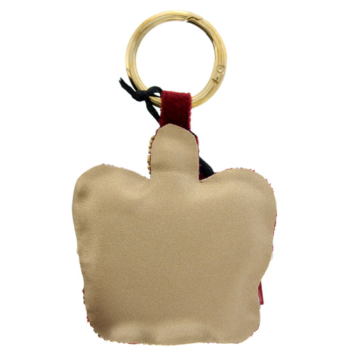 gold backing on a crown shaped keychain - Image