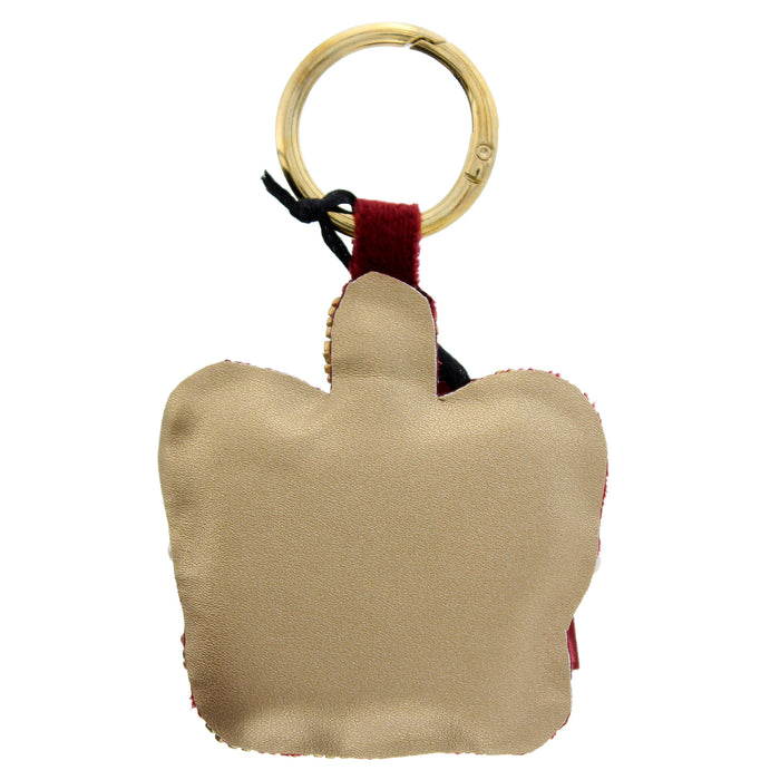 gold backing on a crown shaped keychain - Image