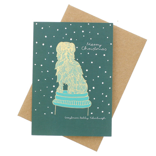 Christmas card with a decorative Greyfriars Bobby design on a green background, featuring snowflakes. - Image