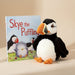 Plush puffin toy next to a book titled 'Skye the Puffling' on a white background - Image
