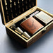 Alcohol set with leather flask, shot glasses, and playing cards in a wooden box. - Image