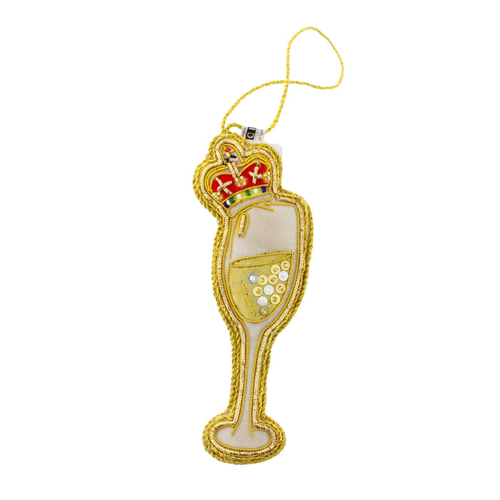 A gold champagne flute-shaped hanging decoration with a red and gold crown at the top, featuring a clear center filled with gold sequins and a hanging loop. - Image