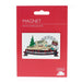 White magnet with Edinburgh Castle with festive decor on a red card.  - Image