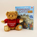 Teddy bear wearing an Edinburgh Castle sweater next to a book titled 'Edinburgh Castle for Kids' on a white background - Image