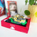 Edinburgh Castle model toy on a red box with a blurred background - Image