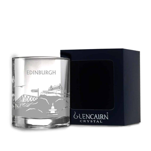 Edinburgh Whisky glass with engraved design and a blue presentation box against a white background.  - Image