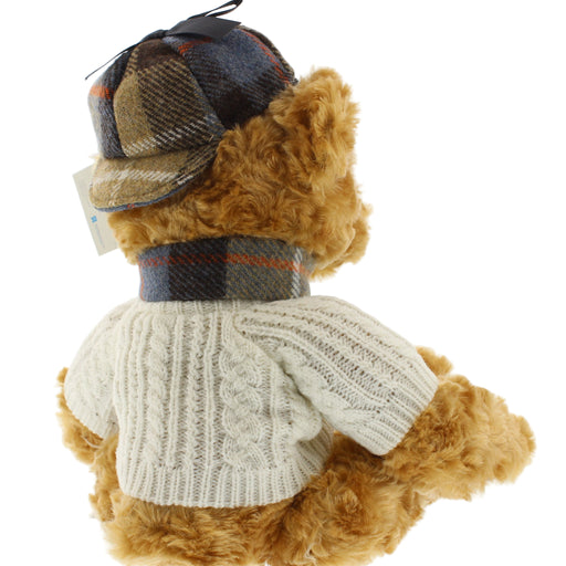 Teddy bear wearing an arran sweater and tweed hat on a white background - Image