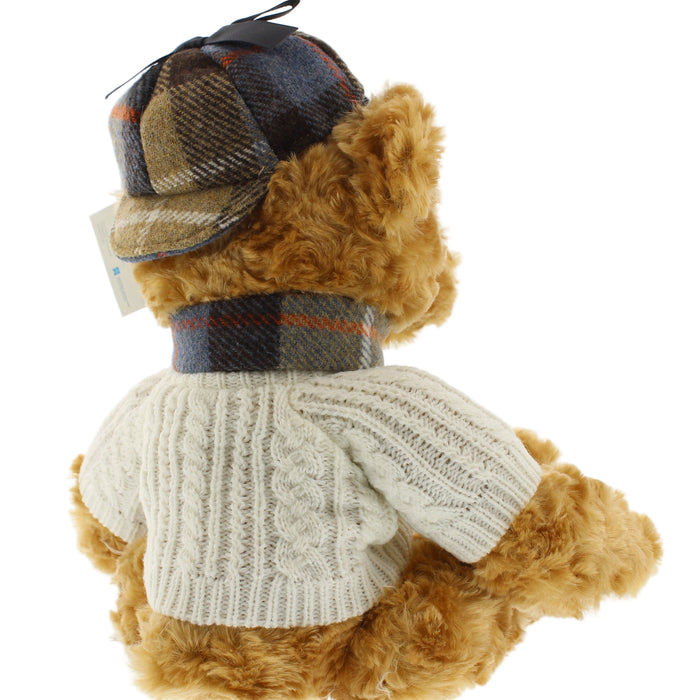 Teddy bear wearing an arran sweater and tweed hat on a white background - Image