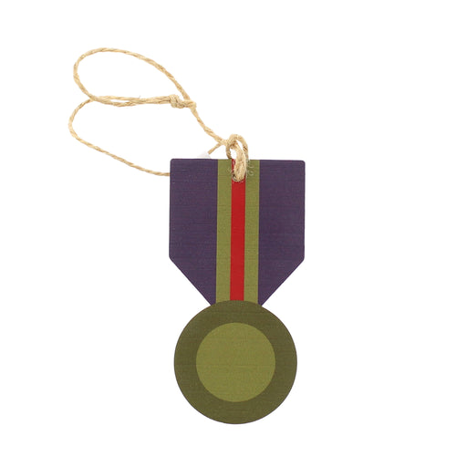 A medal shaped wooden hanging decoration with a natural jute hanging string. - Image