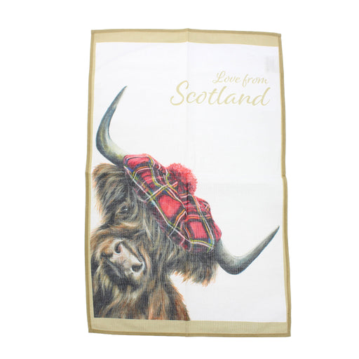 A square white tea towel with a beige border, featuring an illustration of a Highland cow wearing a red tartan kilt and a red pom-pom. The words 'Love from Scotland' are printed in gold script at the top right. - Image